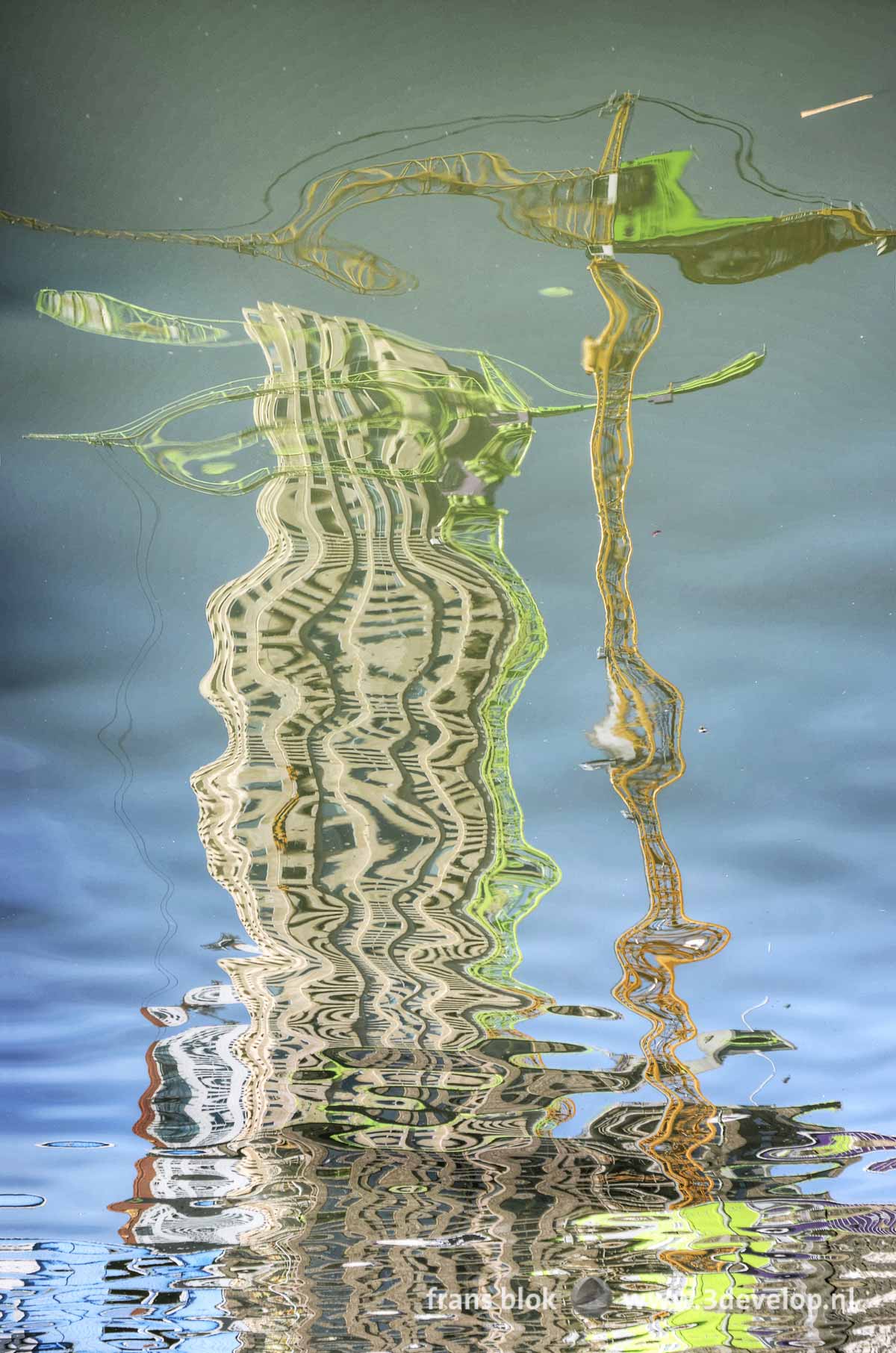 Reflection of a construction crane and two residential towers in the waters of Rijnhaven