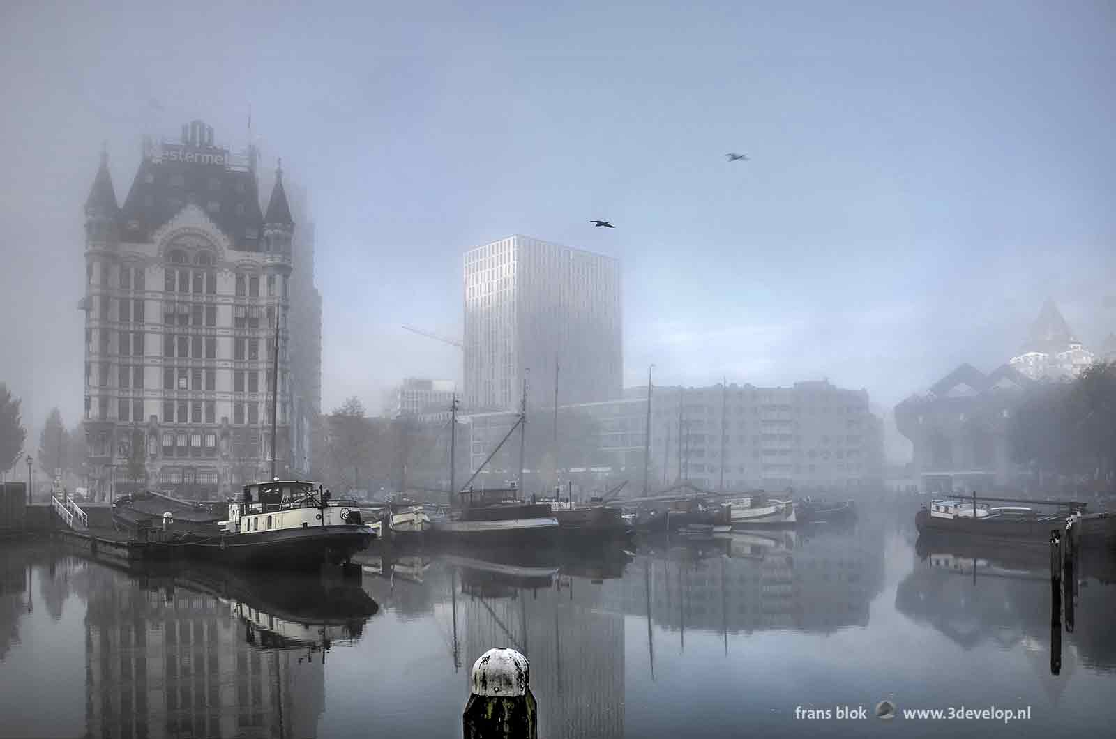 Surrealistic image of the Old Harbour in Rotterdam with the White House and the Cube Dwellings on a misty day in autumn