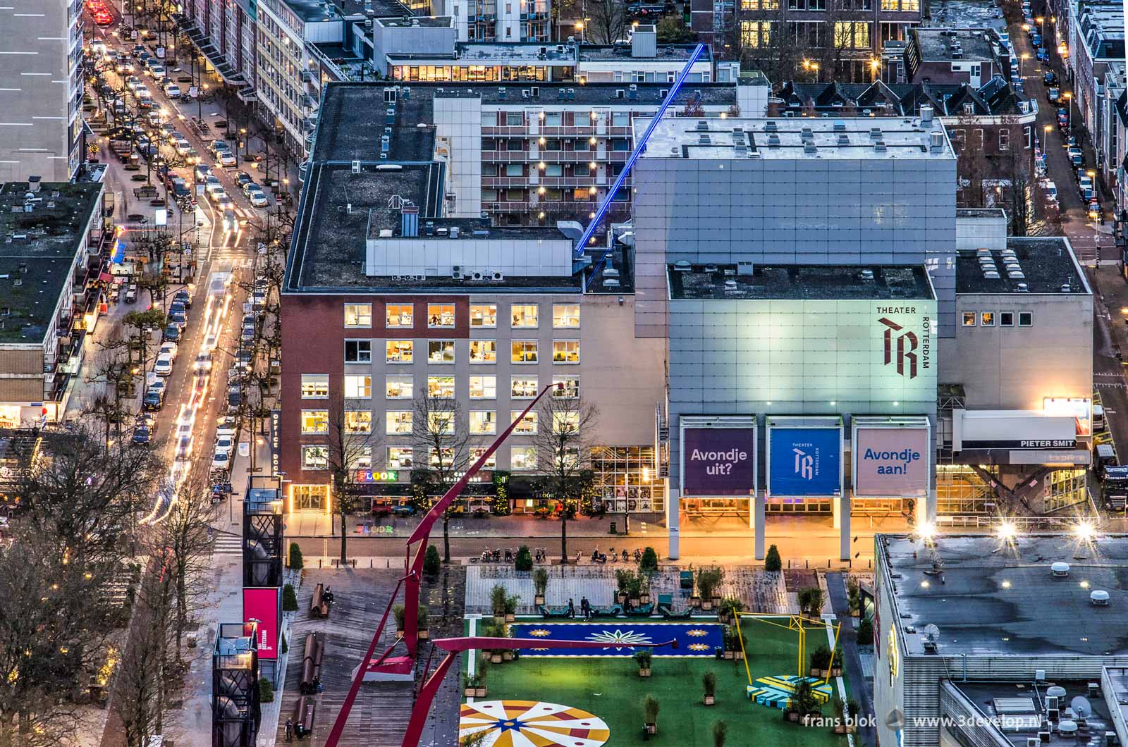 Evening photo of Rotterdamse Schouwburg, Karel Doormanstraat and Schouwburgplein, seen from the Delftse Poort building