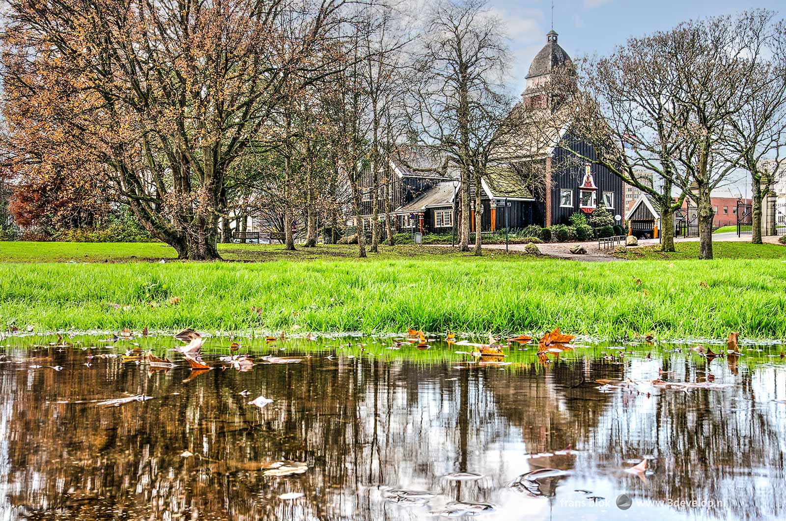 The Park in Rotterdam near the Norwegian Seaman's Church at the end of autumn, with large puddles and almost bare trees