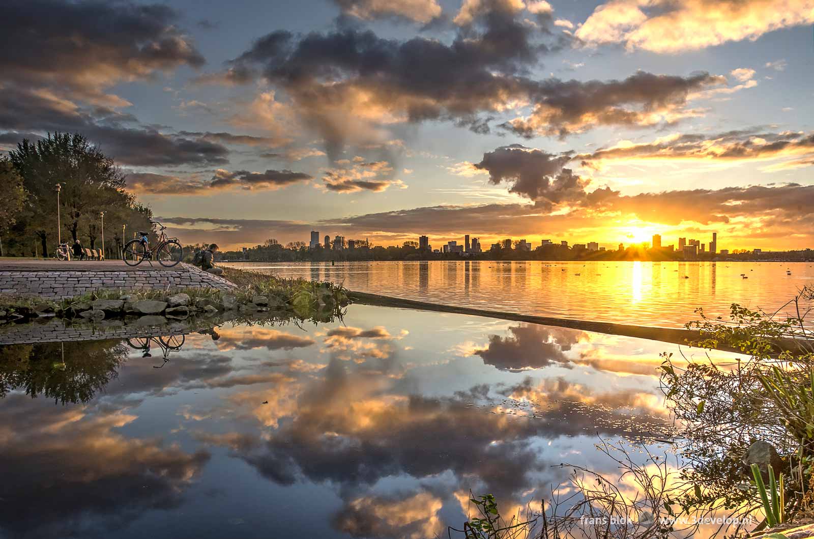 Sunset above the Rotterdam skyline seen from the banks of Lake Kralingen near Minangkabau House, number one in the list of best photos of 2017