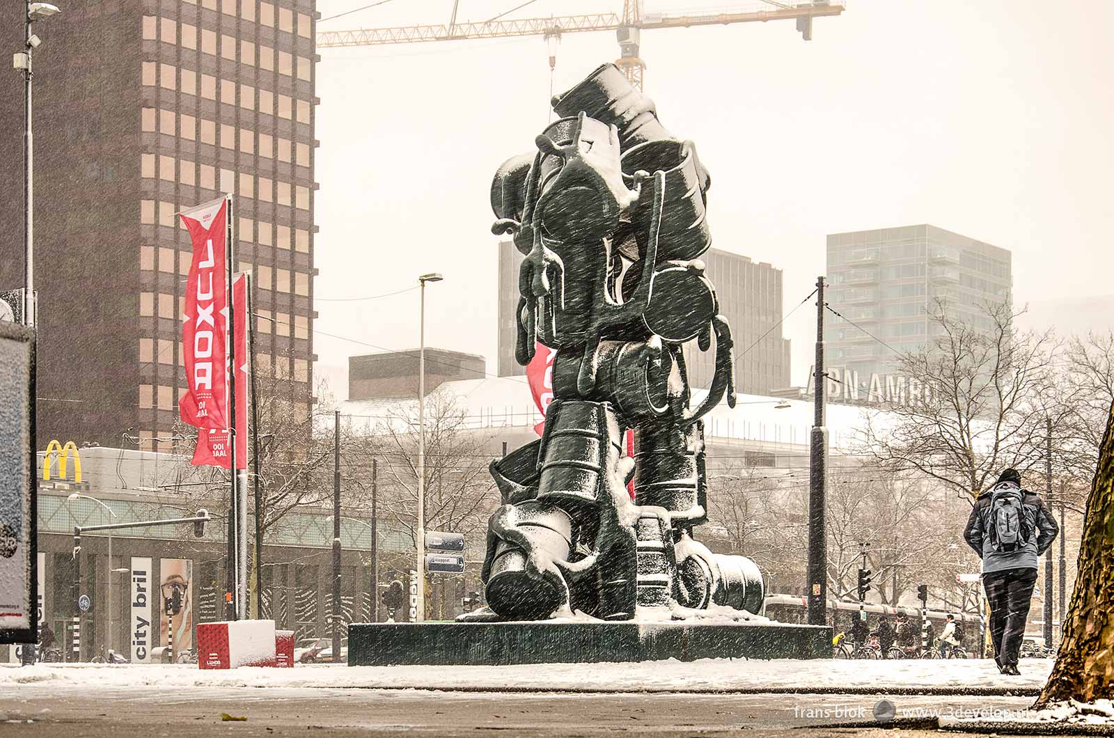 Churchill Square in Rotterdam with the Cascade sculpture by Joep van Lieshout during a snowstorm in december 2017