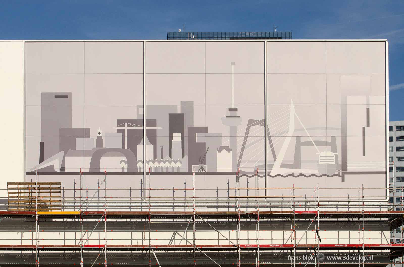 The façade of the Pathé cinema on the Schouwburgplein, partly still in scaffolding, with the image of the Rotterdam skyline