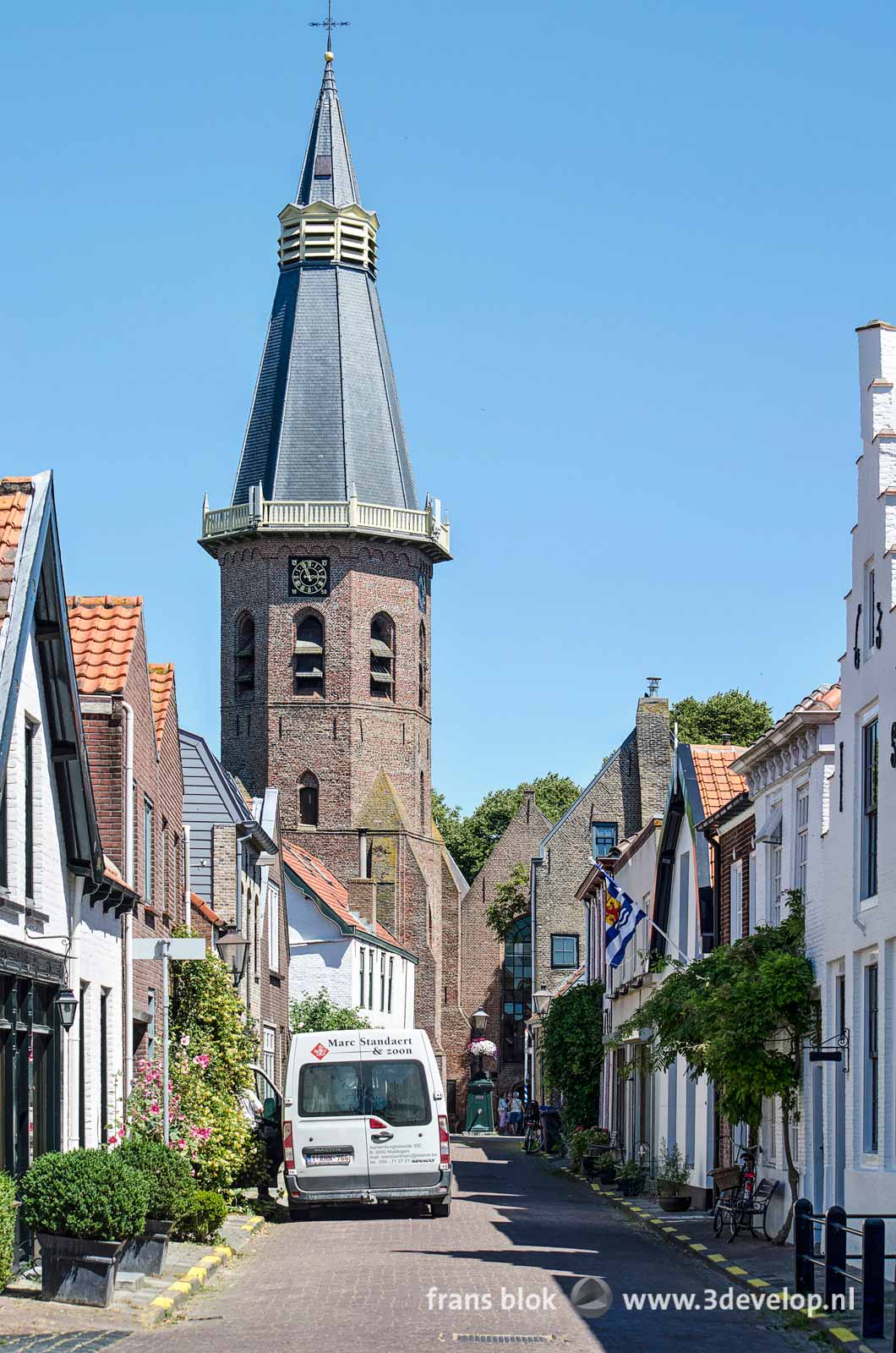 Street leading to the church in Groede in the Netherlands (almost Belgium) with a disfiguring white van in the middle of the picture