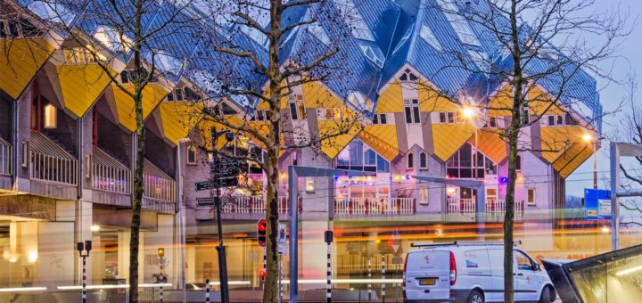 Photo made on an early winter morning of the cube houses in Rotterdam with a disfiguring white van parked in front of them