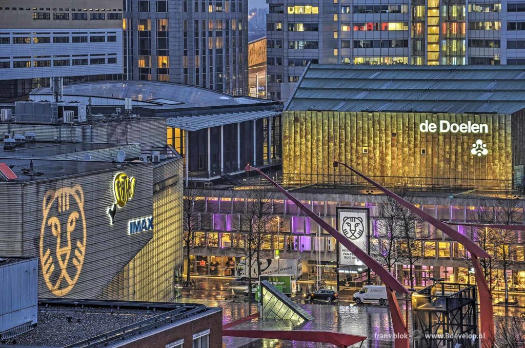 Evening photo, taken from a high point of view, from the Schouwburgplein, the Pathe cinema and the Doelen concert hall in Rotterdam with a disfiguring white truck and white van