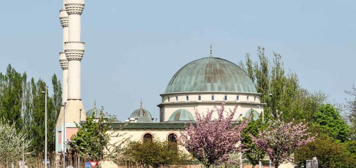 The Mevlana mosque in Rotterdam in springtime with the Schie river in the foreground