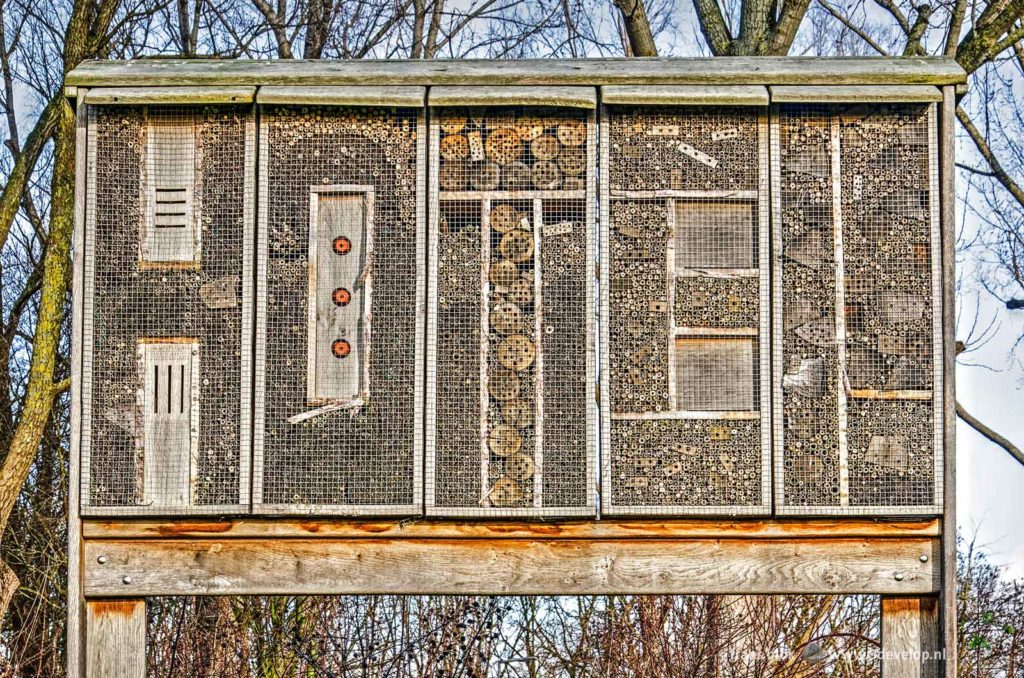 Bee hotel, spelling the word HOTEL, near Spijkernisser bridge in Hoogvliet, The Netherlands