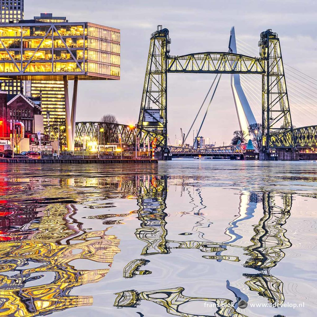 Digitally generated water reflection of railway bridge De Hef, Erasmusbridge and the Unilever building in Rotterdam, The Netherlands in the river Nieuwe Maas