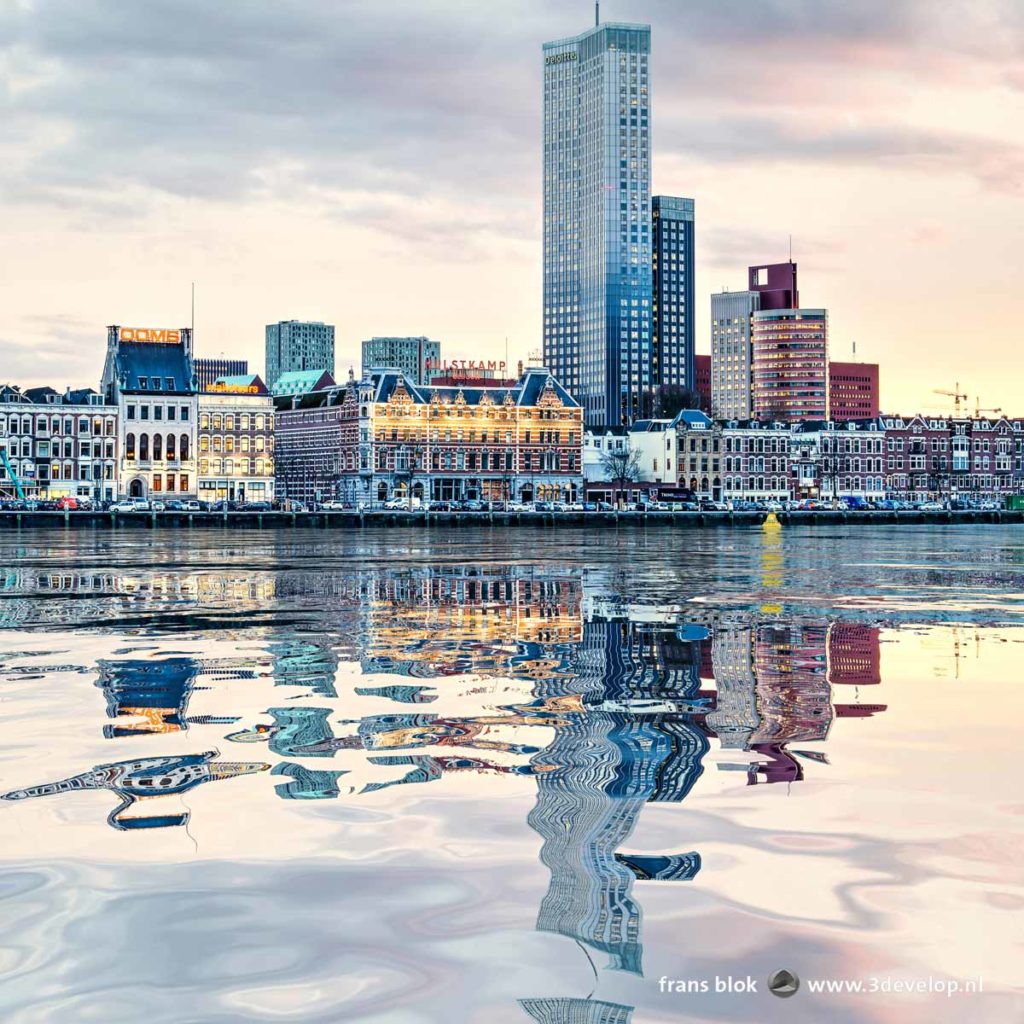 A digital water reflection of Noordereiland and Kop van Zuid skyline in the river Nieuwe Maas in Rotterdam, The Netherlands