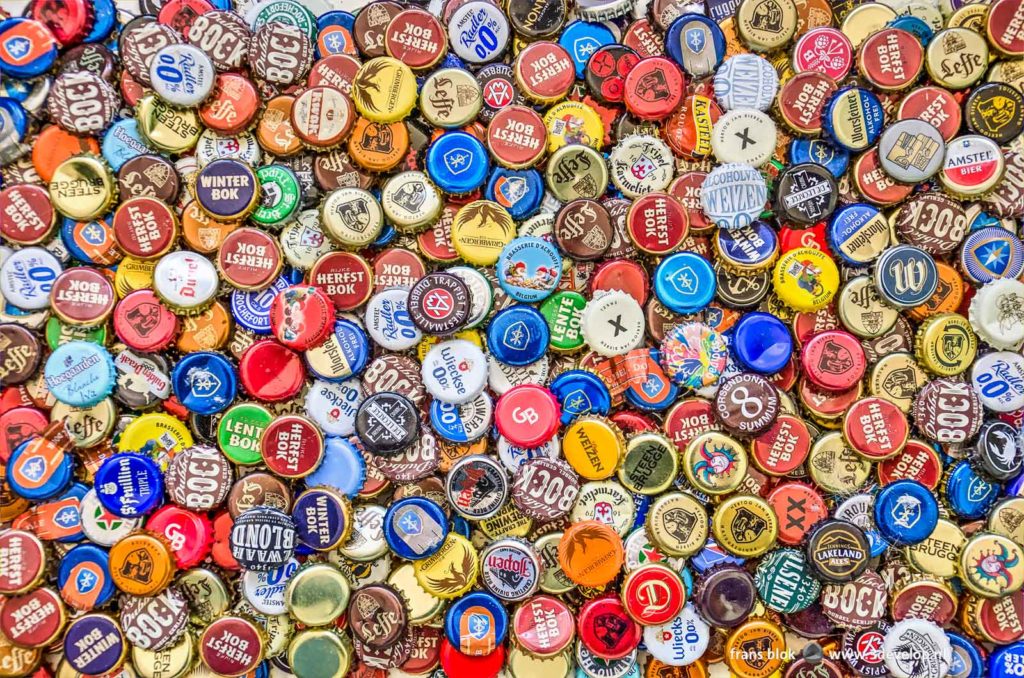 A large variety of crown caps from beer bottles