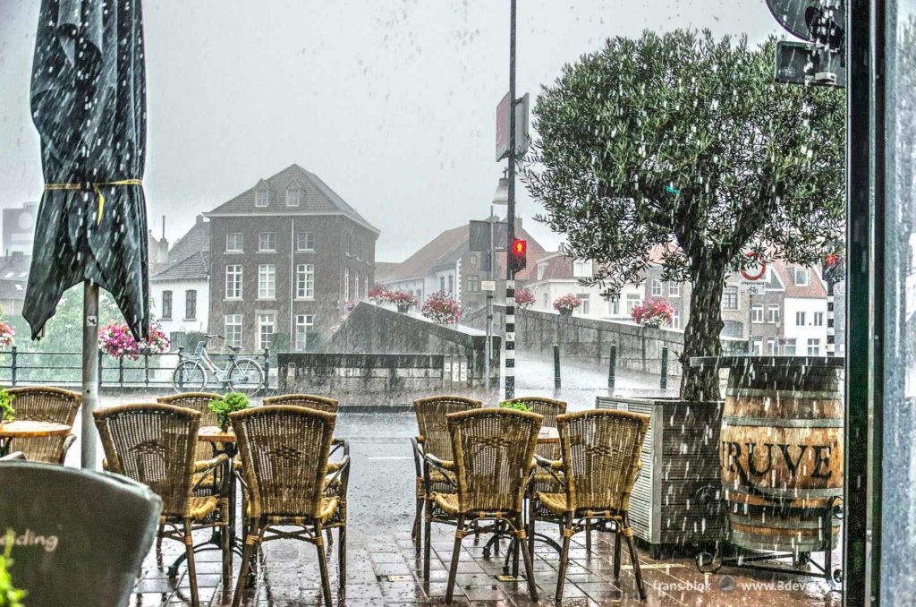 Cloudburst seen from the terrace of a cafe near the Stone Bridge in Roermond, The Netherlands