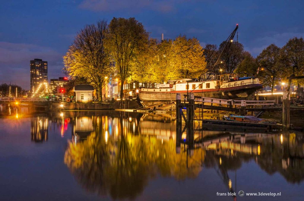 De Koningswerf (Kings Wharf) historic shipyard at the Old Harbour in Rotterdam, The Netherlands, on a windless autumn evening in the blue hour