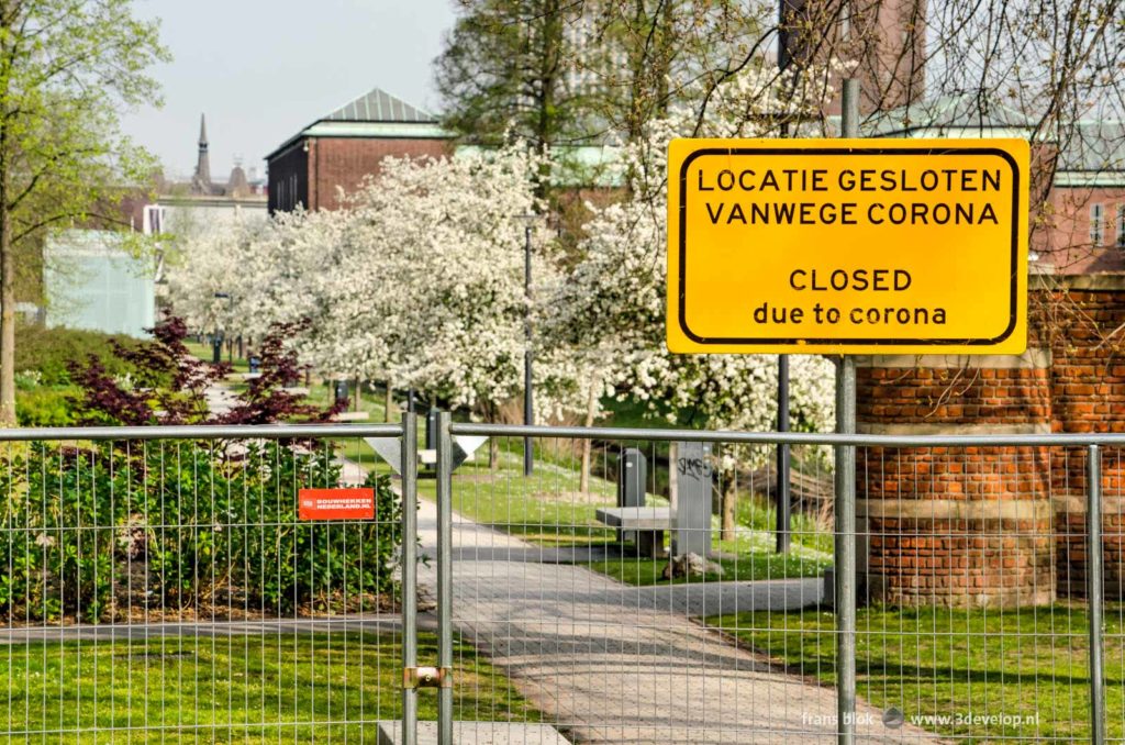 Museumpark in Rotterdam with flowering apple trees, closed due to corona measures in april 2020