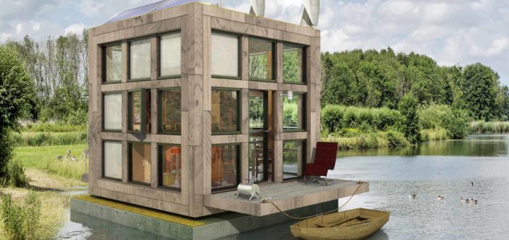 Block's little Block, a tiny houseboat in a green environment with forest, water, shrubs, reeds, grass and geese