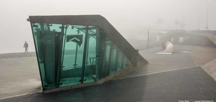 The parking garage entrance near Erasmus bridge in Rotterdam, Holland on a foggy day in autumn