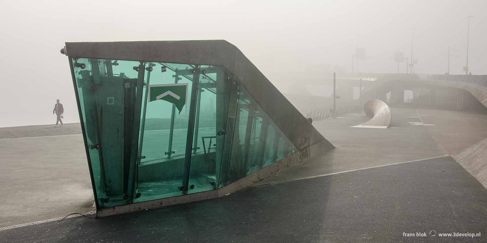 The parking garage entrance near Erasmus bridge in Rotterdam, Holland on a foggy day in autumn