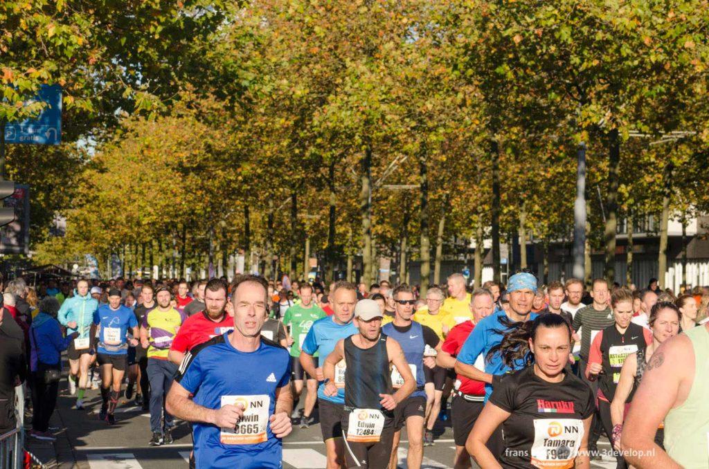 Marathonrunners shortly after the start of the 2021 edition of the Rotterdam marathon on Laan op Zuid boulevard