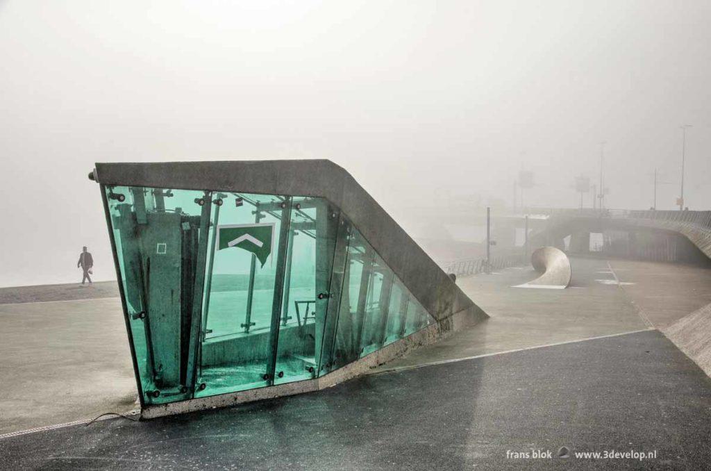 The parking garage entrance near Erasmus bridge in Rotterdam, Holland on a foggy day in autumn