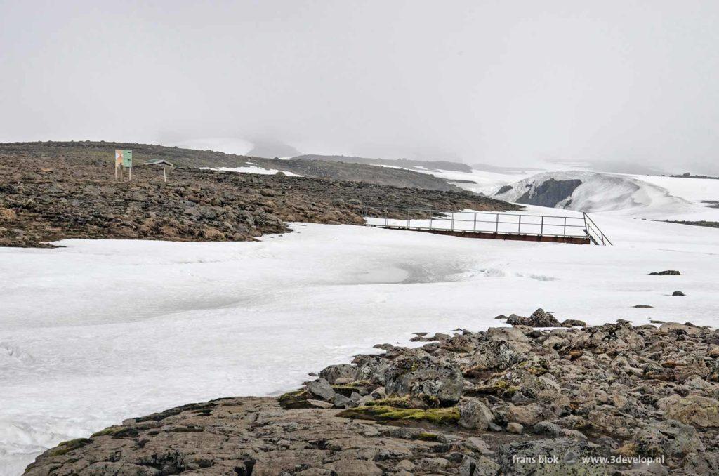 A thick layer of snow at the end of April still blocks the hiking trail towards Fimvorduhals in Iceland