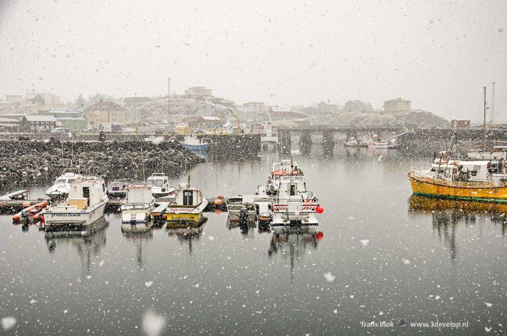 Snowstorm in springtime in the harbour of Stykkisholmur, Snaefellsnes, Iceland