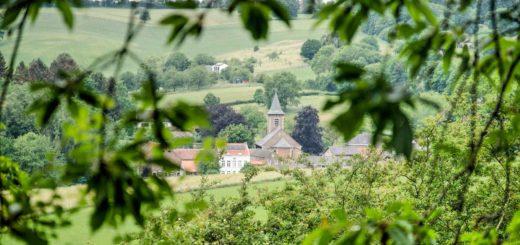 The church in the village of Slenaken, province of Limburg, The Netherlands, seen through the trees in a hilly landscape