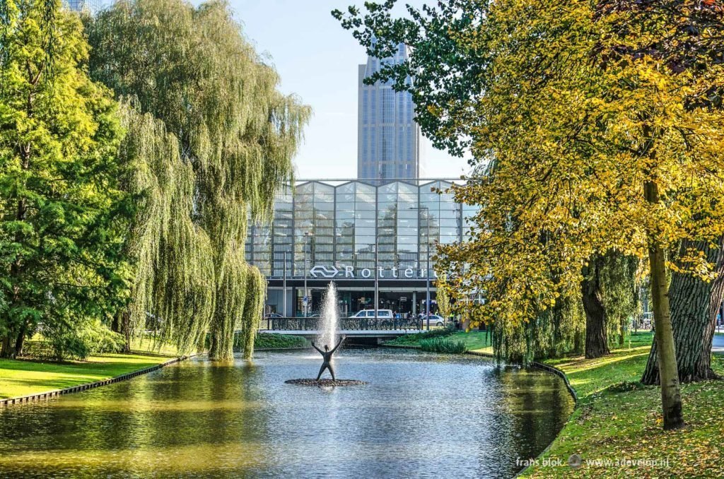 View across Spoorsingel canal in Rotterdam towards the rear side of the Central Station on a sunny day in autumn