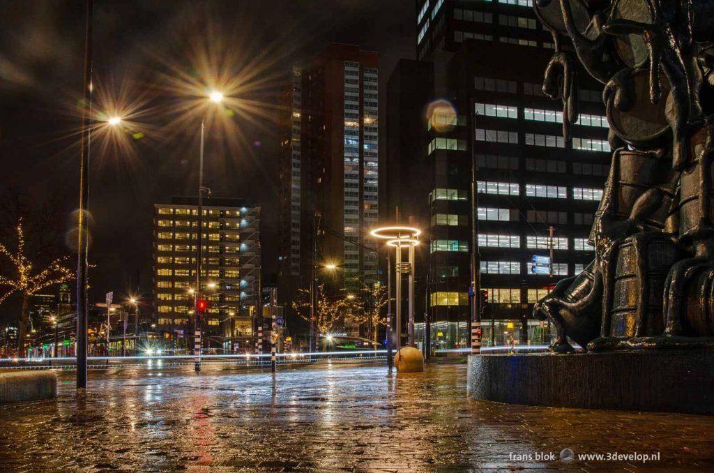 Churchillplein square in Rotterdam on a rainy morning before sunrise