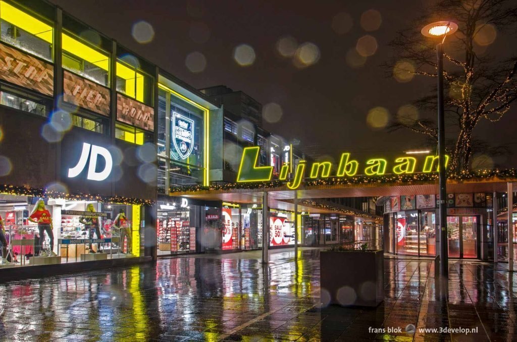 Lijnbaan shopping street in Rotterdam on a rainy morning before sunrise