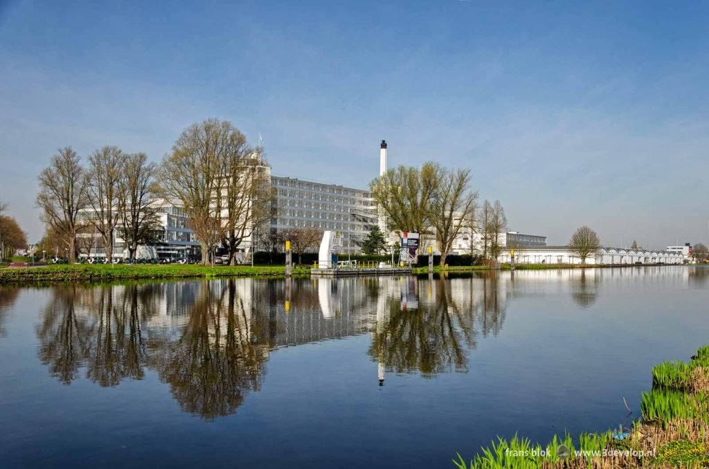 Unesco world heritage the van Nelle factory in Rotterdam, reflecting in the water of the river Schie