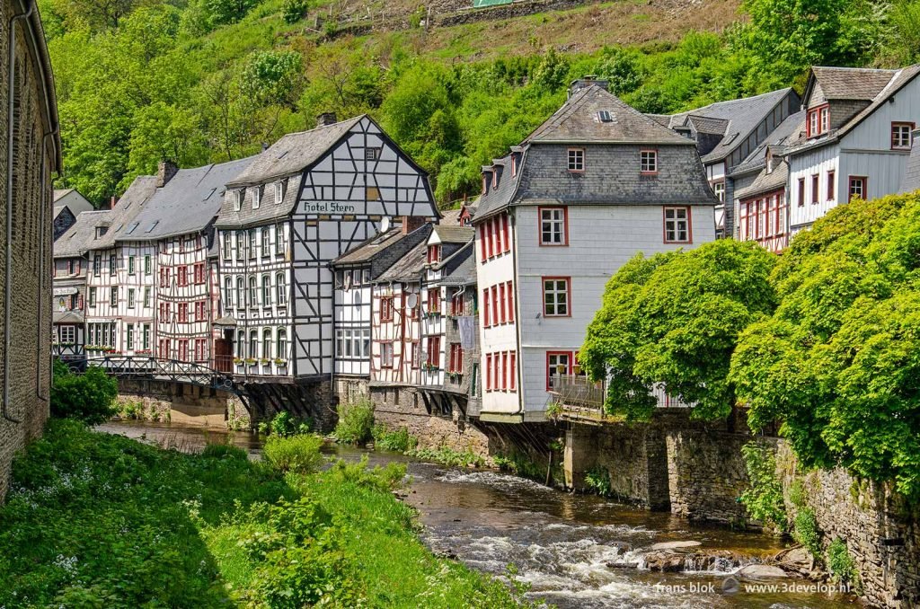 The valley of the Rur in Monschau, Germany with on one side a row of traditional half-timbered houses