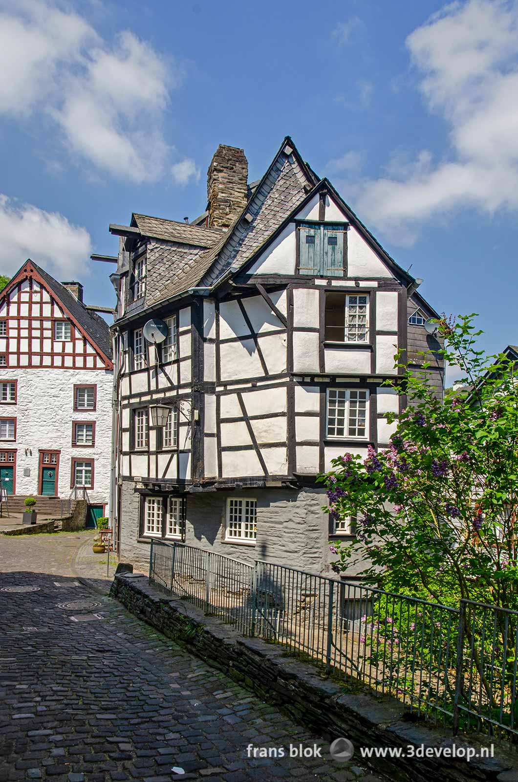 Street scene in Monschau, Germany, with half-timbered houses and facades of stucco and natural stone