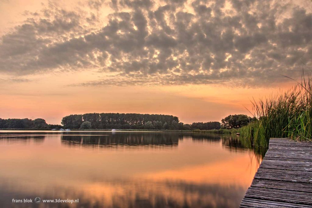 A beautiful evening sky on a midsummer night along the river Rotte, just north of Rotterdam, Holland