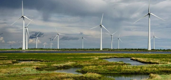 View from Sint Philipsland, Zeeland towards Philips Dam with wind turbines and grassy nature