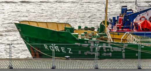 Ship and ugly fence on Park Quay in Rotterdam