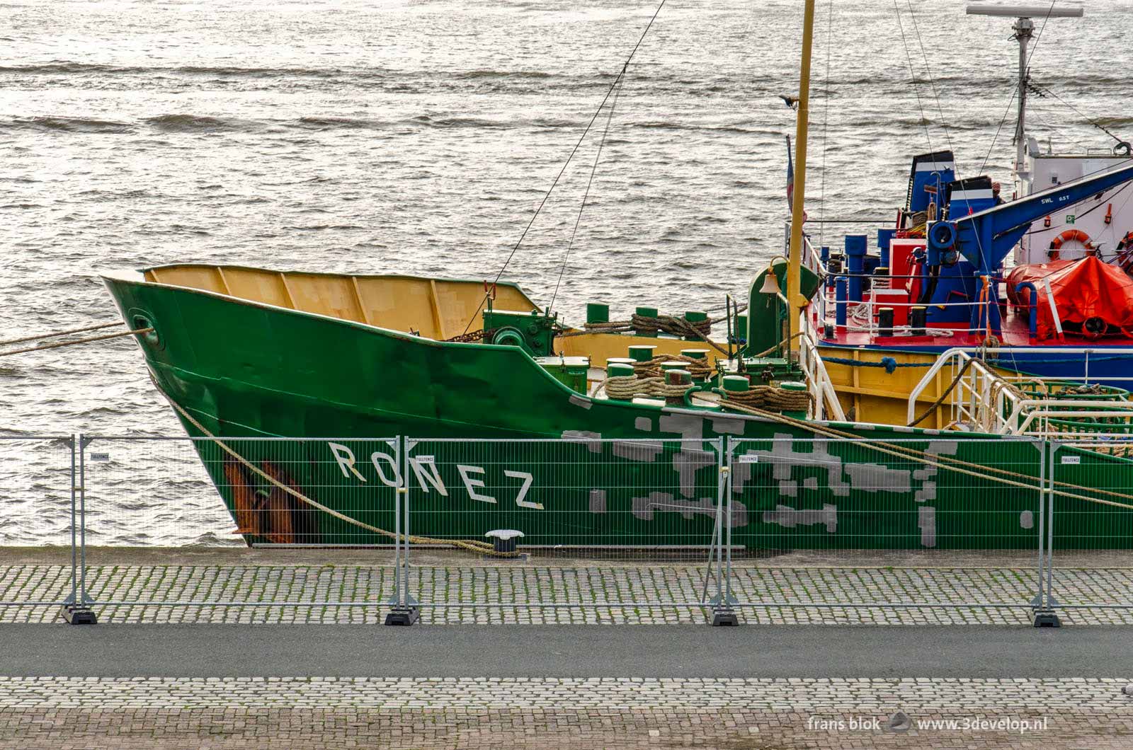 Ship and ugly fence on Park Quay in Rotterdam