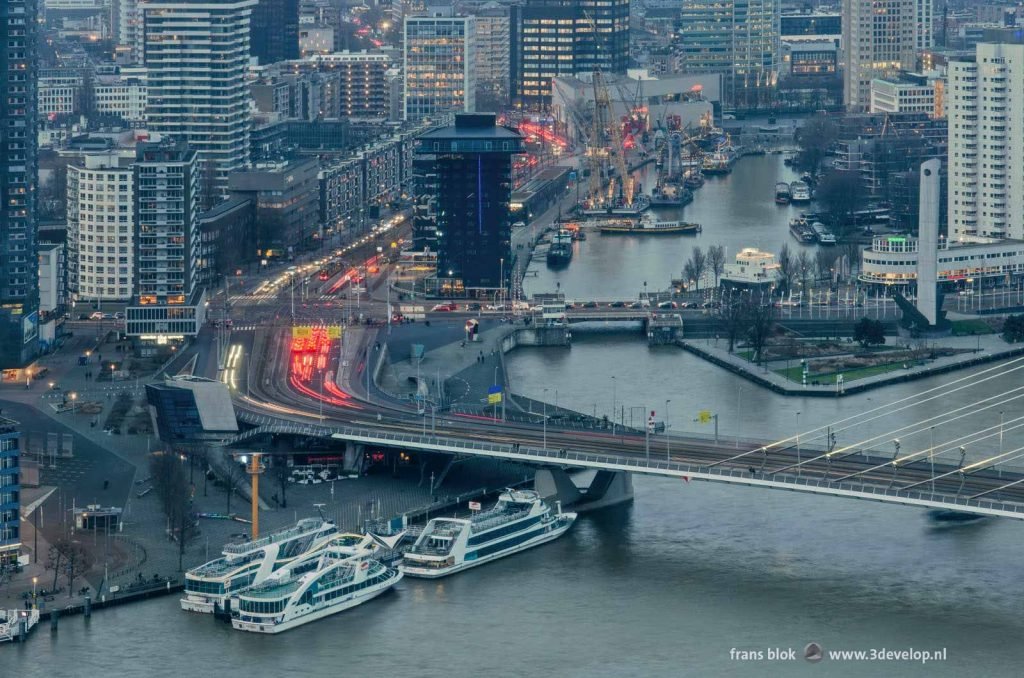 Erasmus bridge and Leuvehaven harbour in Rotterdam during the evening twilight