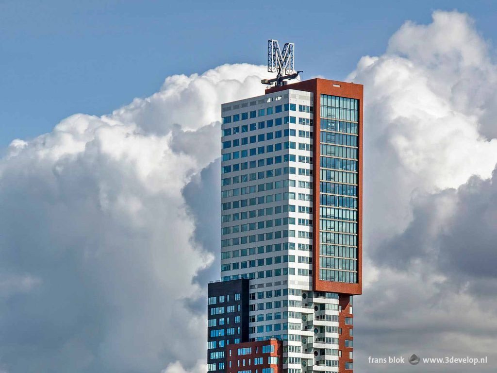 The upper section of residential tower Montevideo in Rotterdam against a dramatic sky