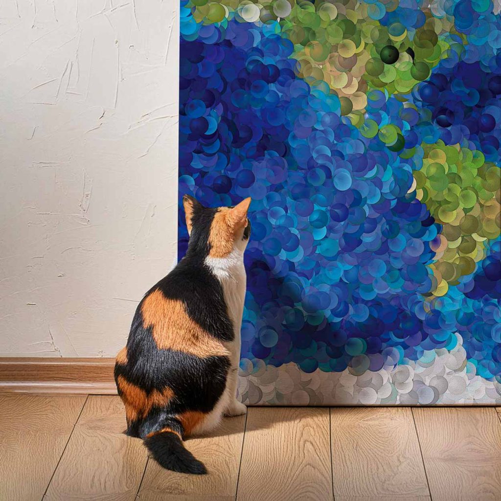 Calico cat studying a canvas print of a world map made of bubbles